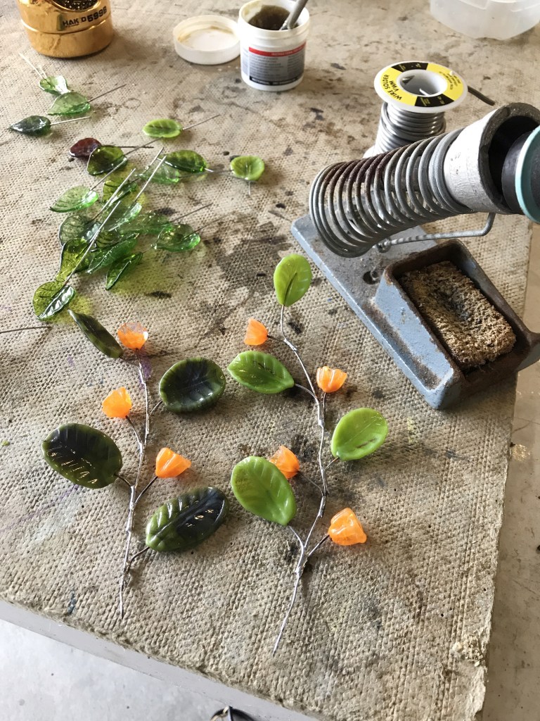 soldering glass flowers and leaves on wires