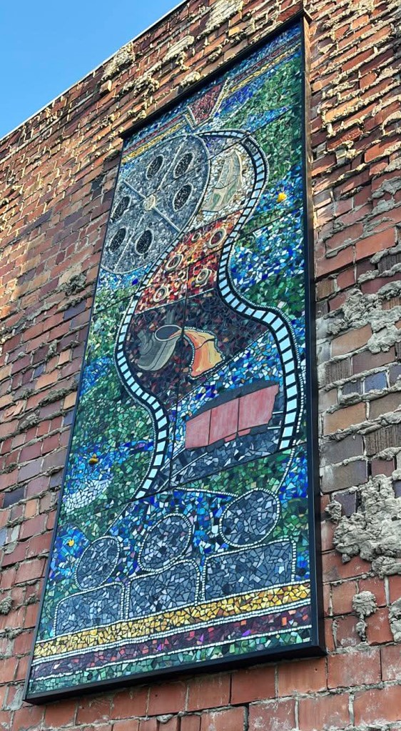 Butler, PA Community Mosaic from the Steeples and Stacks Festival 2026 - mounted on the exterior of the historic Penn Theater